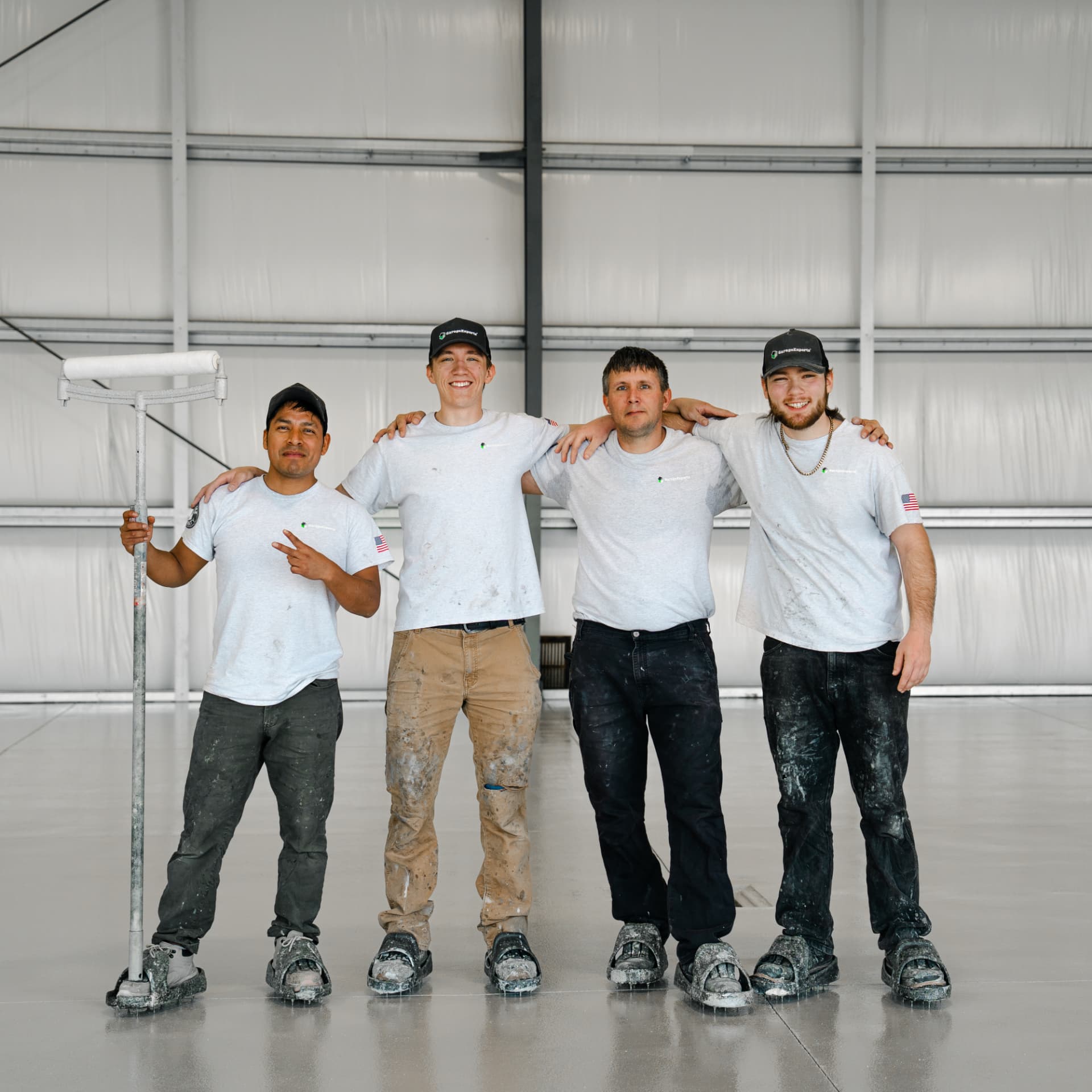 The GarageExperts of Portland install crew standing on a freshly coated floor